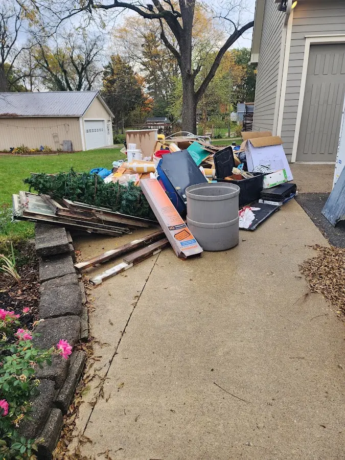 Dumpster being loaded with debris for 3 Yard Dumpster Rental in Hooksett